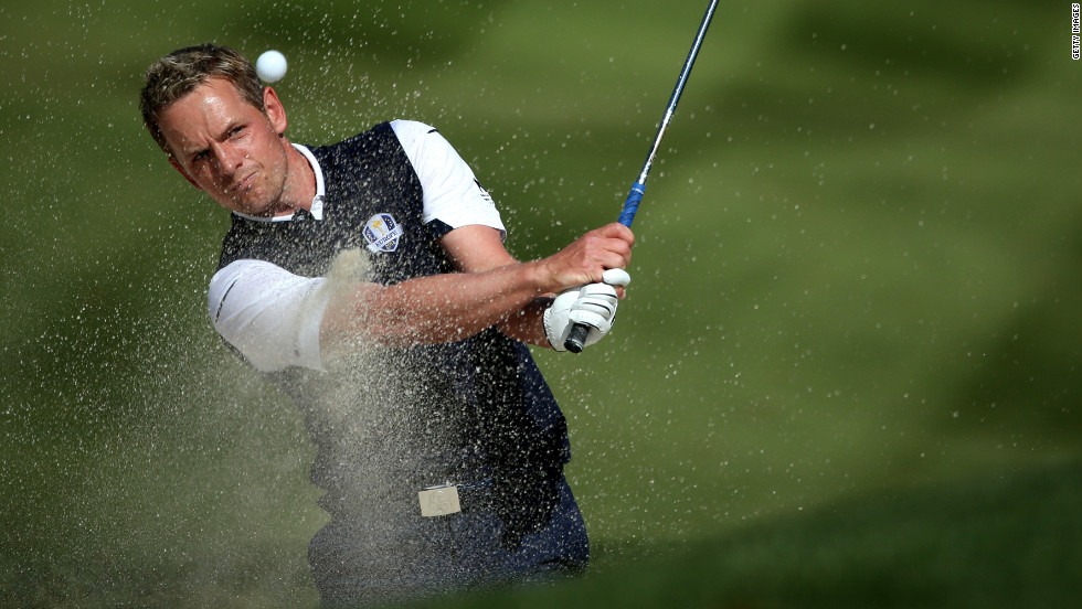 Luke Donald of Europe plays a bunker shot on the fifth hole on Sunday.