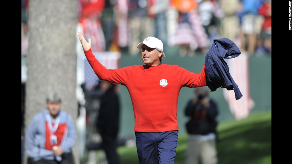 Team USA Assistant Captain Fred Couples stirs up the crowd during play Sunday.