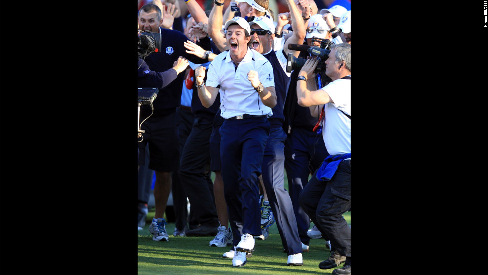 Rory McIlroy of Europe celebrates after Martin Kaymer sinks his putt on the 18th green Sunday.