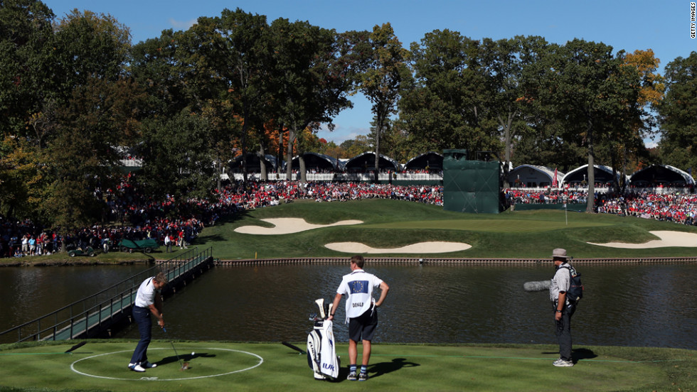 Luke Donald of Europe hits from the drop zone Sunday on the 13th hole.