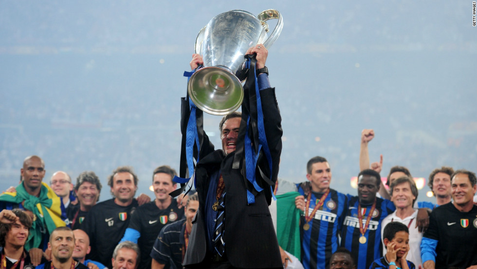 Mourinho holds the Champions League trophy aloft at the Santiago Bernabeu following his side&#39;s 2-0 win over Bayern Munich. He became the third man in history to win the competition with two different clubs after Ernst Happel and Ottmar Hitzfeld.