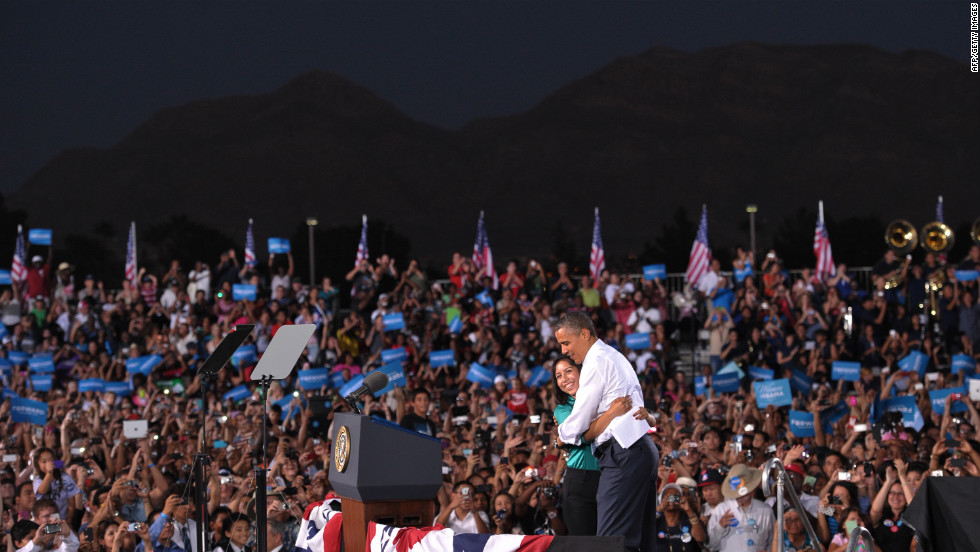 Obama hugs Chasstiry Vazquez after she indroduced him at a campaign event at Desert Pines High School in Las Vegas on Sunday, September 30.