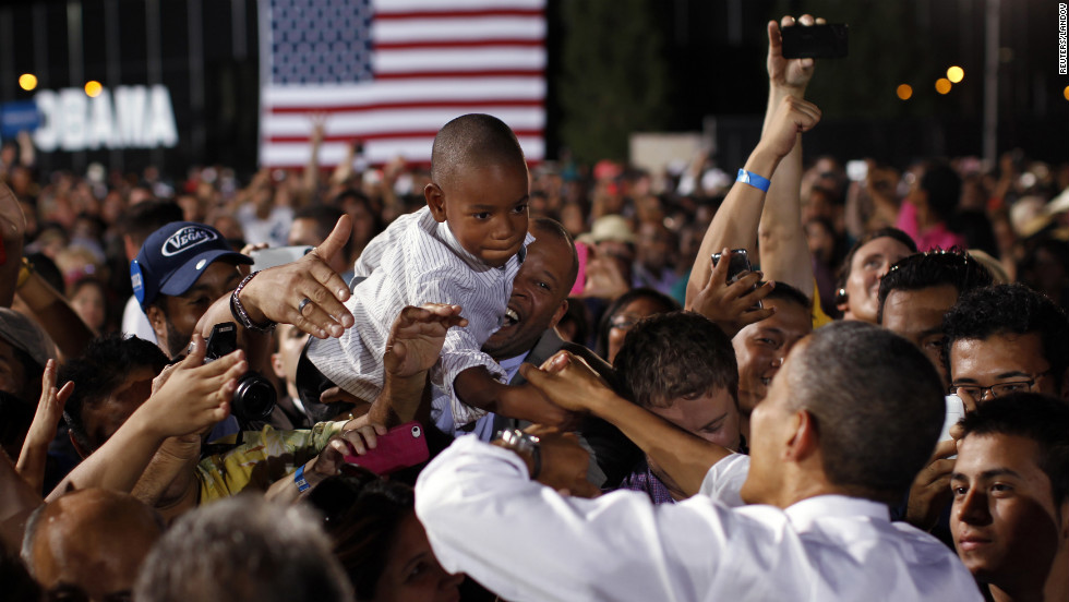 A boy reaches out to shake hands with Obama on Sunday in Las Vegas. The president was in Nevada ahead of Wednesday&#39;s presidential debate in Denver.