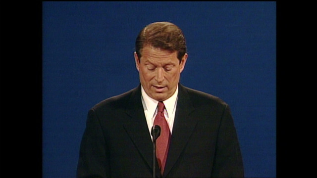 Al Gore sighs while Bush speaks