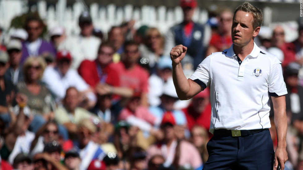 Luke Donald of Europe celebrates after saving bogey Sunday on the 13th green.