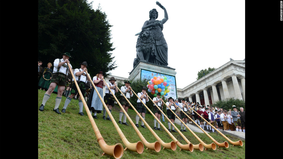 Alphorn musicians play at the foot of the Bavaria monument Sunday.