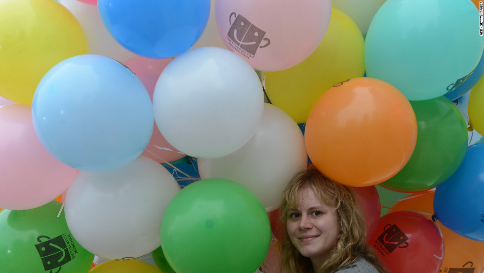A girl holds balloons during Sunday&#39;s concert.