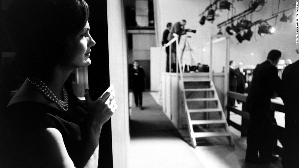 Jacqueline Kennedy watches from the wings as her husband debates Richard Nixon.
