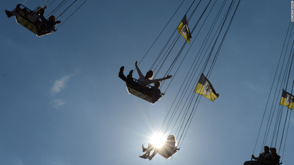 Festivalgoers enjoy a ride at the Theresienwiese fairgrounds in Munich, Germany, at the Oktoberfest beer festival on Tuesday, October 2. 