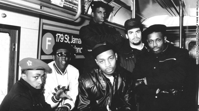The original members of Public Enemy pose in a New York City subway car.