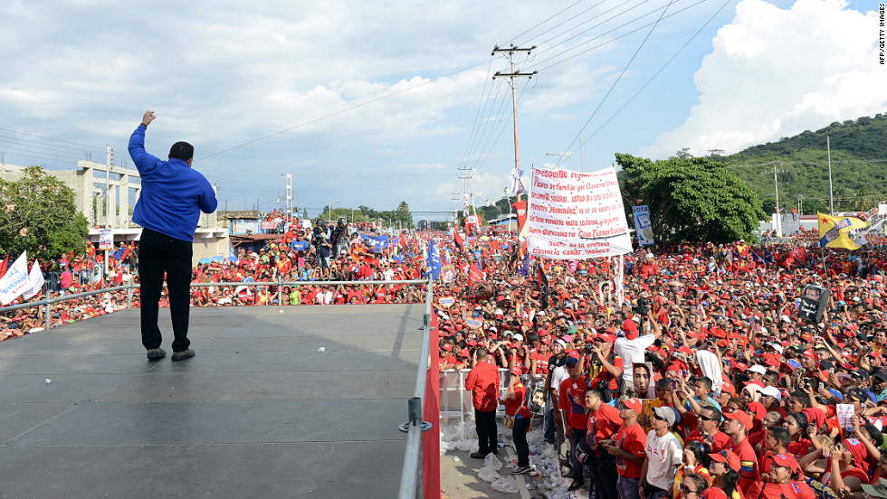 Chavez waves to supporters on Tuesday.