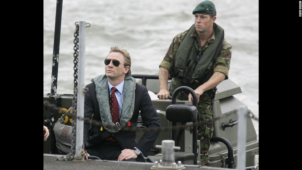 Daniel Craig greets a naval officer as he is unveiled as the new James Bond in October 2005.