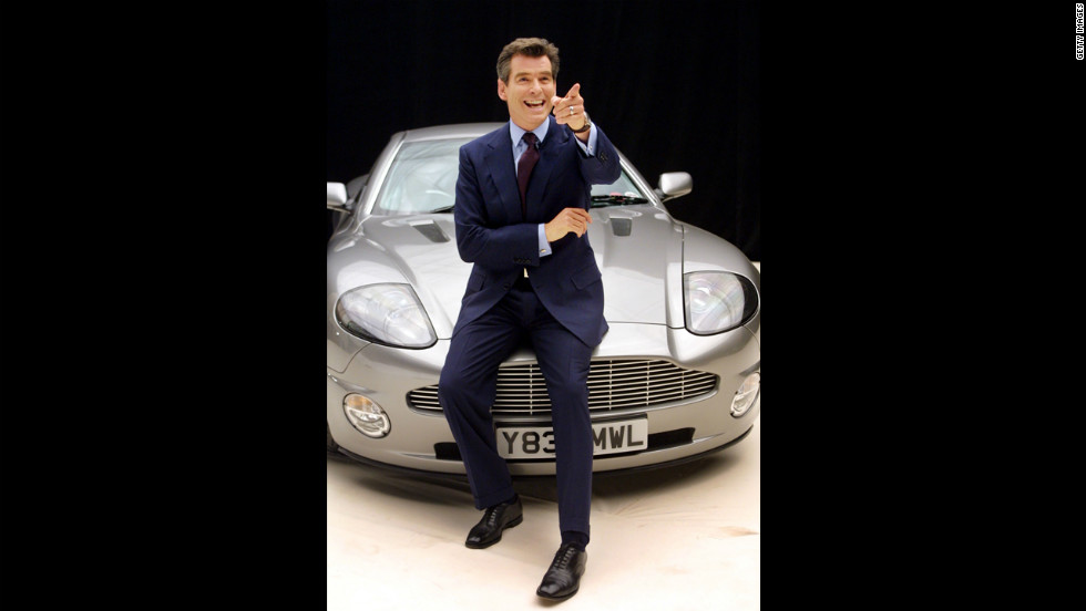 Pierce Brosnan poses on an Aston Martin before starting filming on &quot;Die Another Day&quot; in January 2002. 