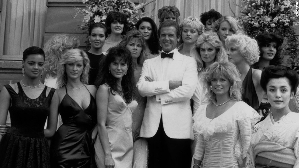 Roger Moore poses with the  Bond Girls from the film &quot;View to a Kill&quot; in 1984.