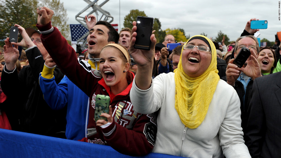 Audience members cheer as Obama makes his way onto the stage at Sloan&#39;s Lake Park in Denver on Thursday.