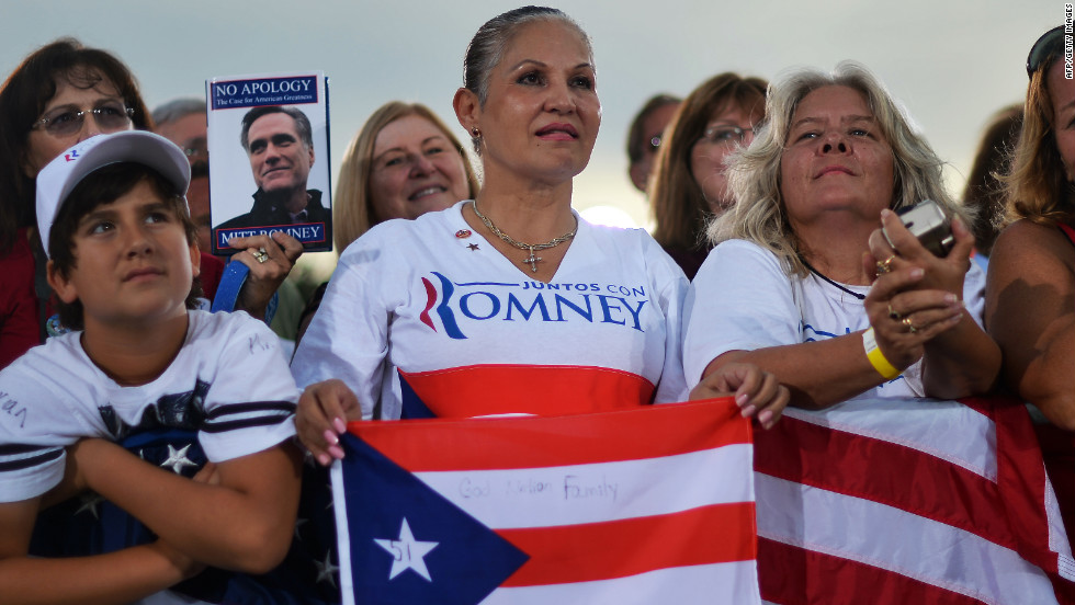 Romney supporters listen during Friday&#39;s campaign event in St. Petersburg.