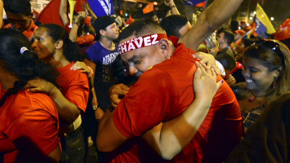 Chavez supporters celebrate after receiving news of his victory Sunday night in Caracas.