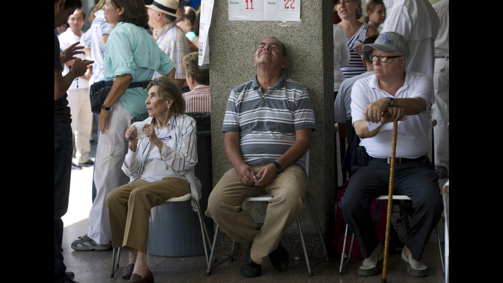 People wait to vote Sunday at a polling station in Caracas.