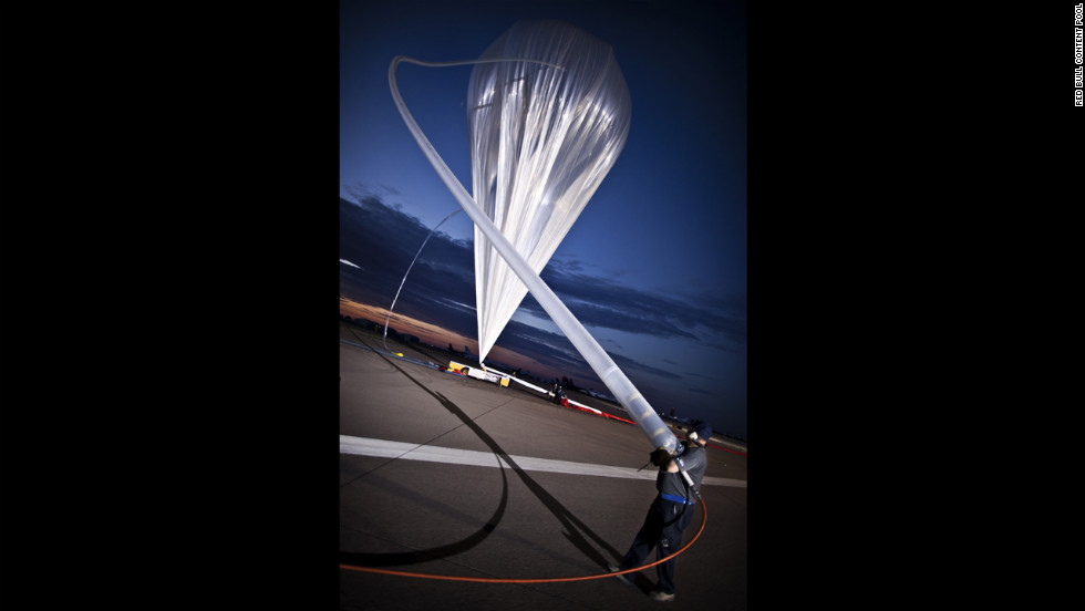 ATA crew members fill the balloon with helium at the flight line on July 25.