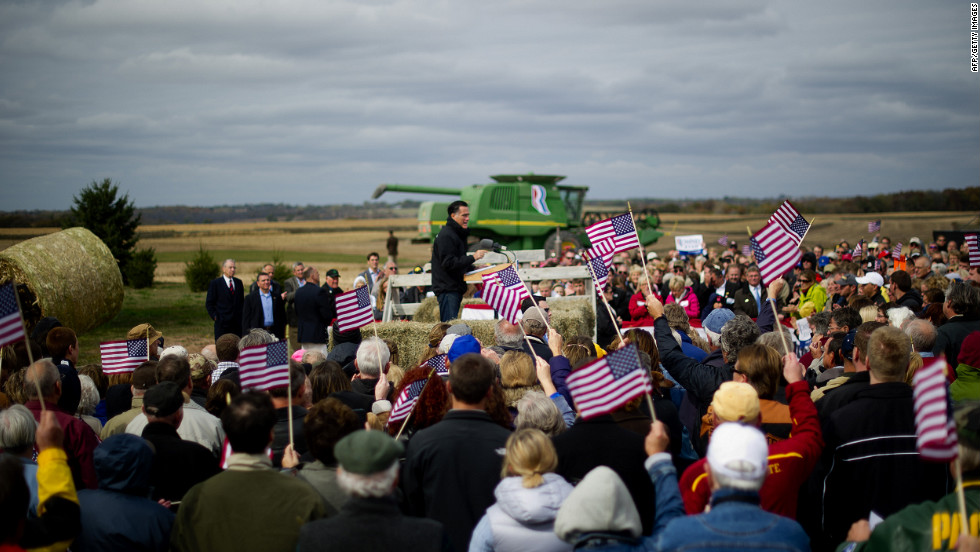 Supporters cheer as Romney delivers remarks on the James Koch Farm in Van Meter, Iowa, on Tuesday.