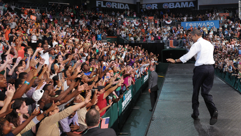 Obama greets supporters at a campaign rally at the University of Miami on Thursday.