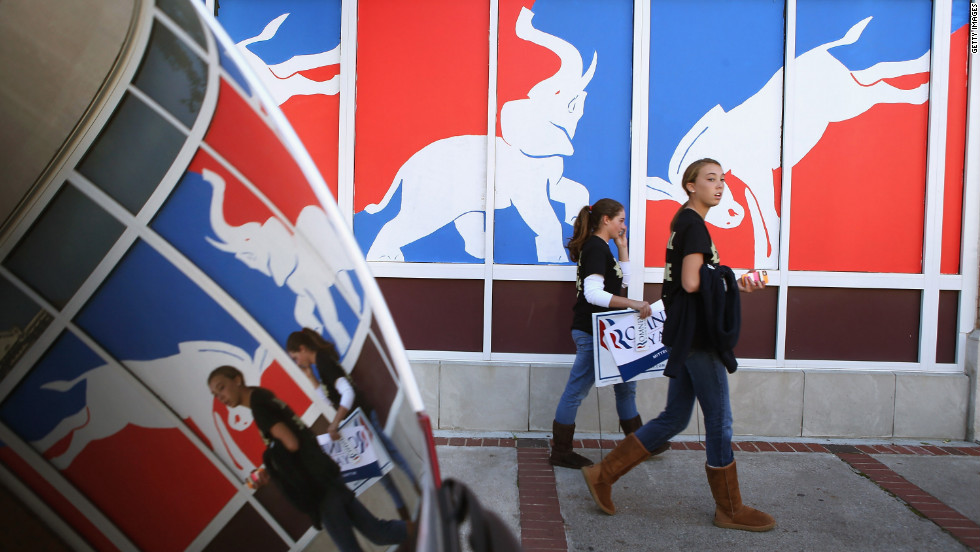 Students walk past a political mural near Centre College in downtown Danville, Kentucky, where Vice President Joe Biden and Republican vice-presidential nominee Rep. Paul Ryan faced off Thursday, October 11.