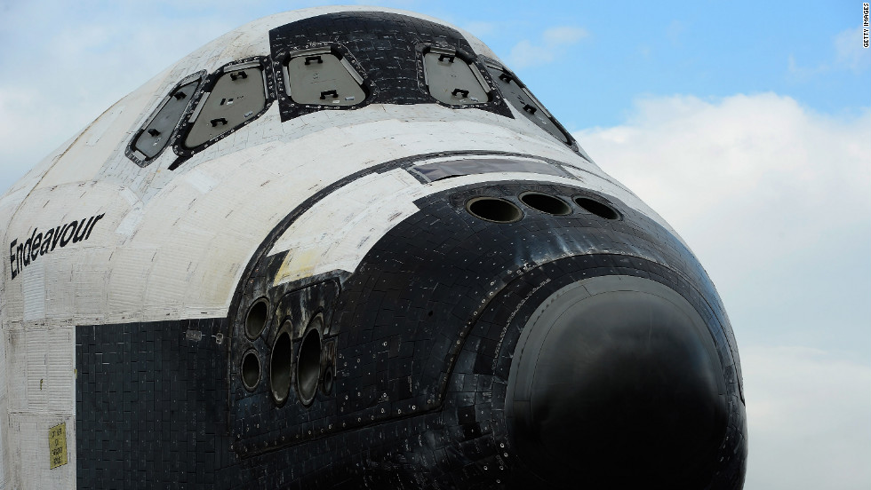 The space shuttle Endeavour is parked in a mall parking lot on its way to the California Science Center. 