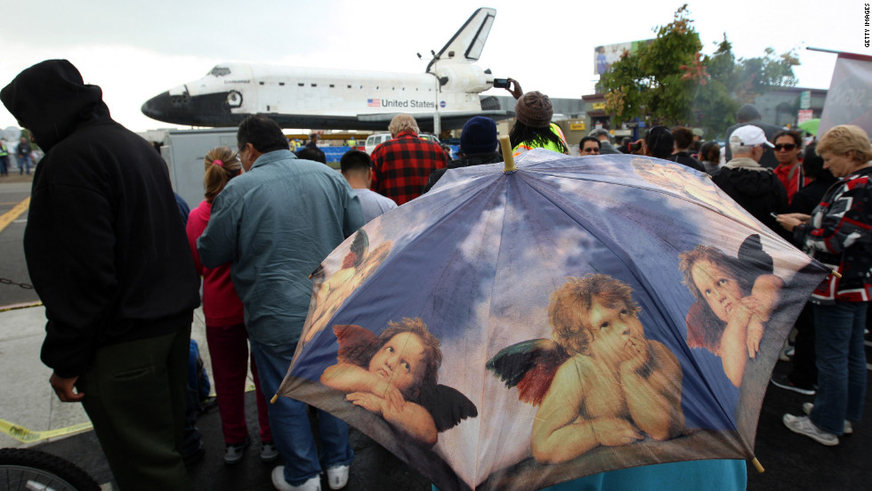 People get a close view of the space shuttle Endeavour in a misty rain during a break in its journey on Friday.