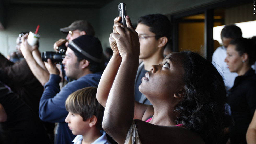 Spectators crowd for a view of Endeavour as it passes through Los Angeles on Friday.