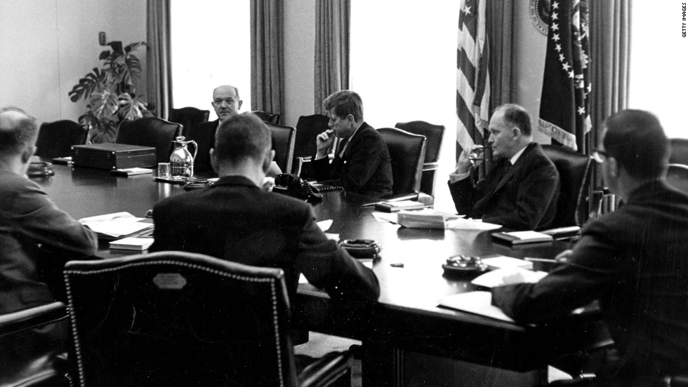 President John F. Kennedy meets with aides.