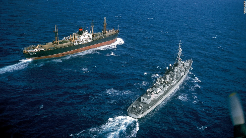 American destroyer USS Vesole (DD-878) escorts the Russian freighter Polzunov into international waters, bringing an end to the Cuban missile crisis in October 1962.