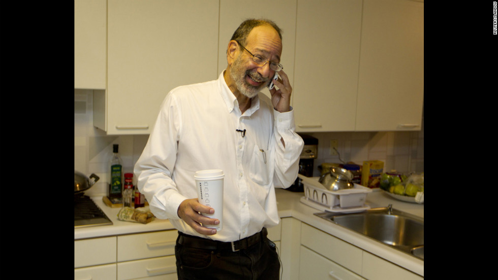 Alvin Roth receives congratulatory phone calls at his home in Menlo Park, California, on Monday, October 15, after winning the Nobel Memorial Prize in Economics, which he shared with Lloyd Shapley. Roth was &quot;surprised&quot; and &quot;delighted&quot; when he got the midnight call at his California home telling him he had won.