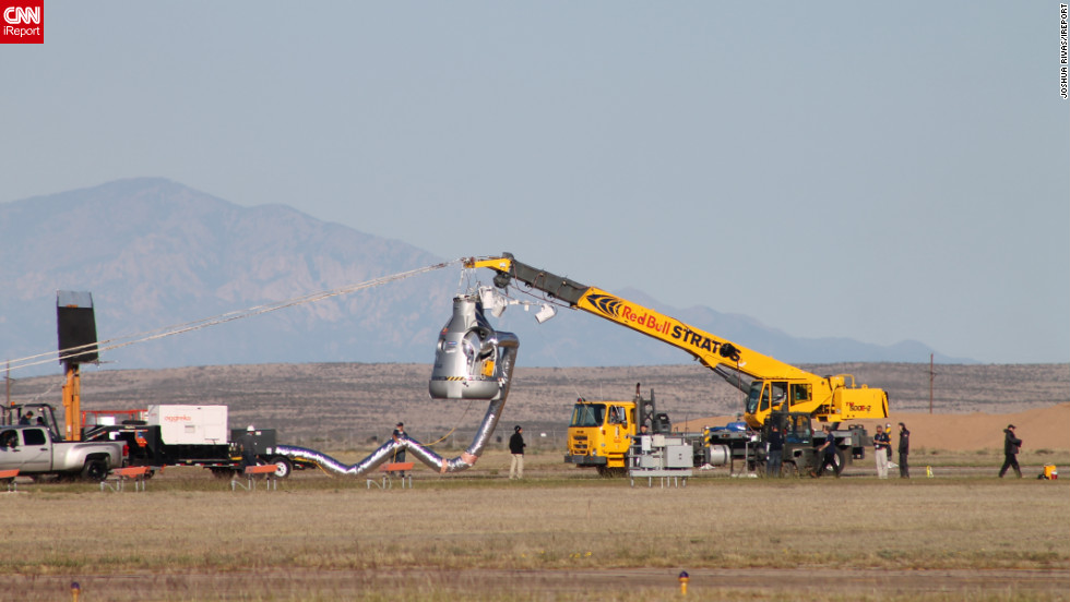 &lt;a href=&quot;http://ireport.cnn.com/docs/DOC-858210&quot;&gt;CNN iReporter Joshua Rivas&lt;/a&gt; watched crews prepare the capsule before sending Baumgartner into the air.