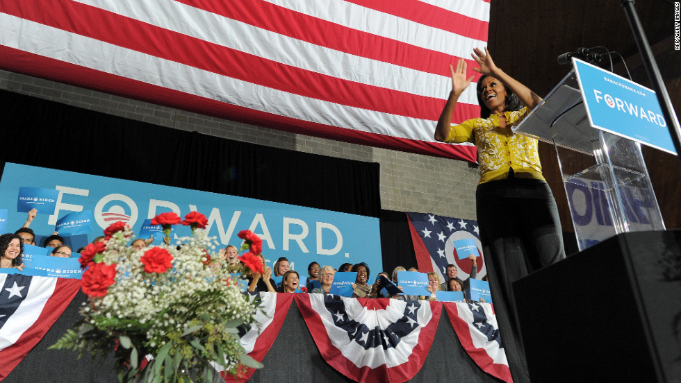 First lady Michelle Obama greets supporters during a campaign rally at Ohio Wesleyan University in Delaware, Ohio, on Monday, October 15.