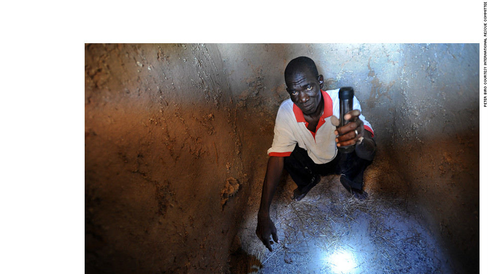 The drought has devastated the already dry Sahel region. Crops have failed, and the lean season—when food from the last harvest has run out—has arrived early. Food is available in the markets, but prices are too high for the poorest people. Here, Lamine Samaké, from the village of Diallakoroba, shows his empty grain storage hut. &quot;This time last year it was almost full with millet,&quot; he says. 