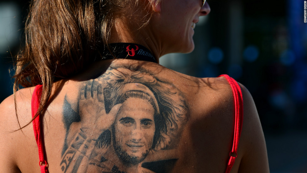 As MotoGP returns to Malaysia for the first time since the tragic death of Marco Simoncelli, the Italian&#39;s memory is very much to the fore of the sport. Here, a fan of the rider, shows her devotion with a tattoo in tribute to her hero who died following a fatal crash on October 23 2011.