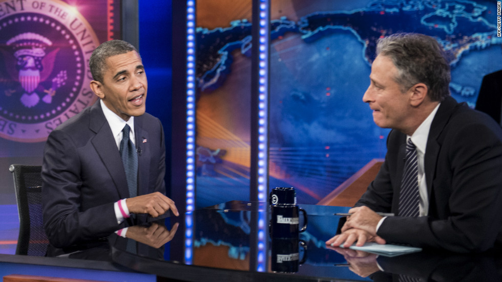 Barack Obama and Jon Stewart speak during a break in the live taping of Comedy Central&#39;s &quot;The Daily Show with Jon Stewart&quot; on Thursday.