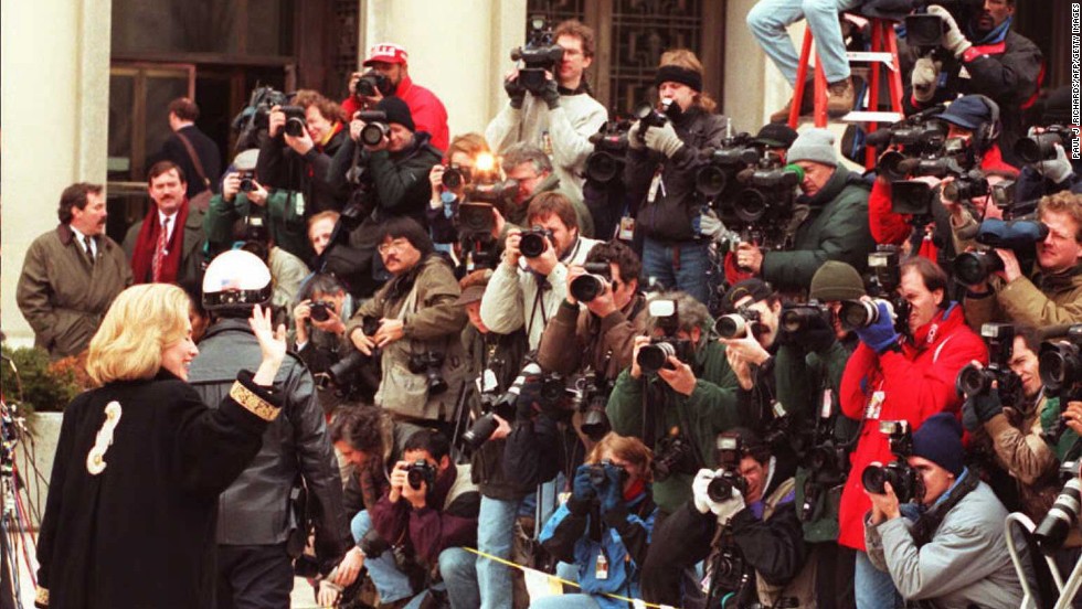 Clinton waves to the media in January 1996 as she arrives for an appearance before a grand jury in Washington. The first lady was subpoenaed to testify as a witness in the investigation of the Whitewater land deal in Arkansas. The Clintons&#39; business investment was investigated, but ultimately they were cleared of any wrongdoing.