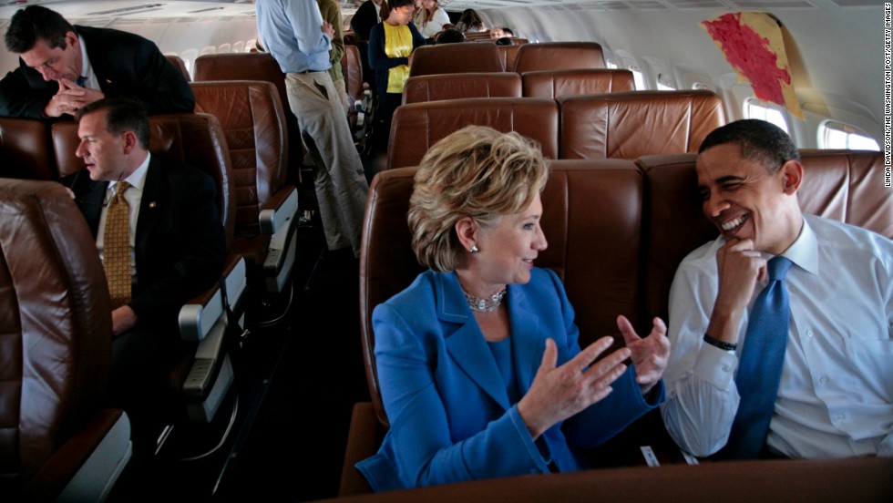 Obama and Clinton talk on the plane on their way to a rally in Unity, New Hampshire, in June 2008. She had recently ended her presidential campaign and endorsed Obama.