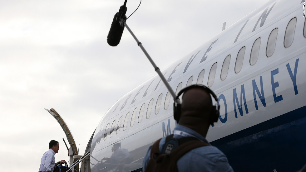 Romney boards his campaign plane at Newark Liberty International Airport on Friday, October 19.