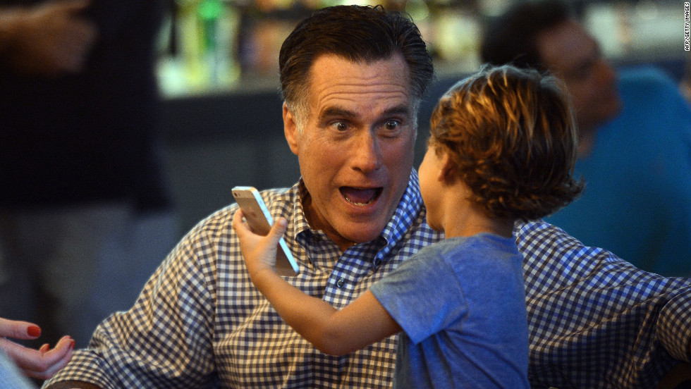 Republican candidate Mitt Romney plays with his grandson while having dinner on Sunday in Delray Beach, Florida.