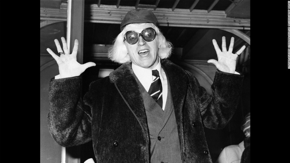 Savile arrives in London in 1972 on his way to Buckingham Palace, where he is to be awarded the Order of the British Empire.
