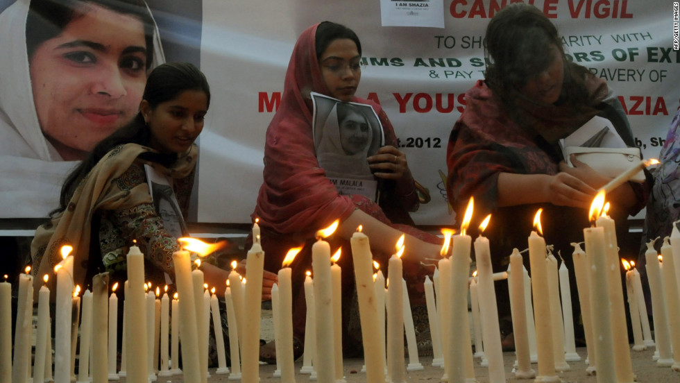 Pakistani human rights activists light candles during a Sunday, October 21, 2012, vigil for Malala Yousufzai in Lahore. 