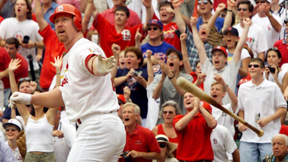 An Olympian and renowned long-ball hitter, Mark McGwire spent his entire career with the Oakland A&#39;s and St. Louis Cardinals, breaking the single-season home run record in 1998. In 2010, he admitted using steroids over the course of a decade but told Bob Costas in an interview he took them only for health reasons.