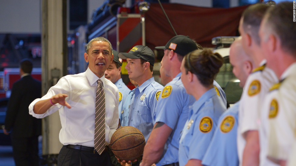 Obama chats with firefighters after dropping off doughnuts for them at a fire station in Tampa, Florida, on Thursday, October 25.