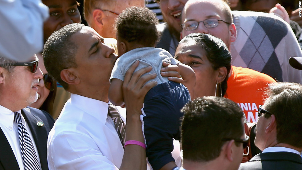 Obama kisses a baby during a campaign rally at Byrd Park in Richmond, Virginia, on Thursday.