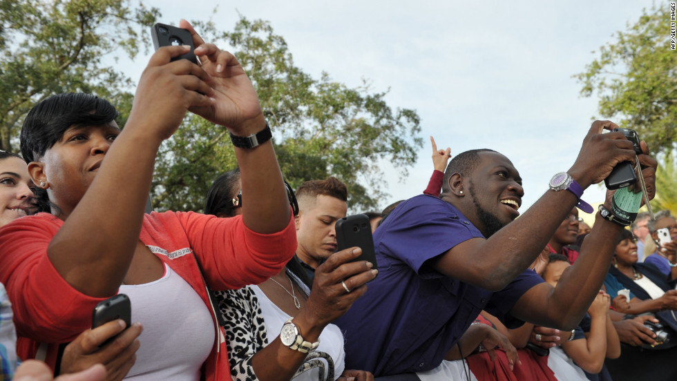 Supporters take photos of Obama during a campaign rally at Ybor City Museum State Park in Tampa on Thursday.