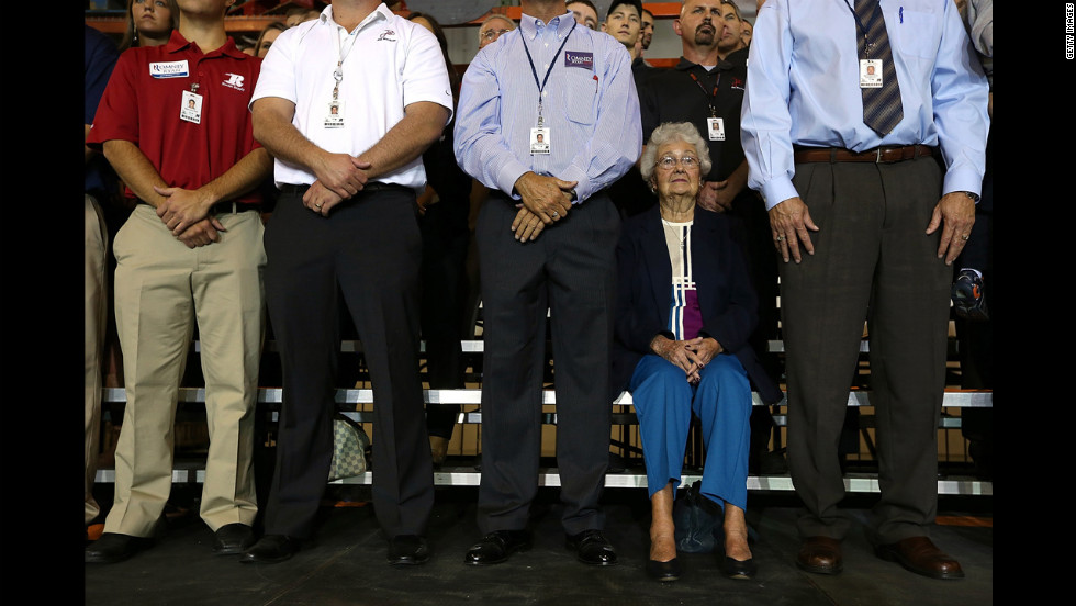 Supporters look on as Romney speaks during a campaign rally at Jet Machine in Cincinnati.