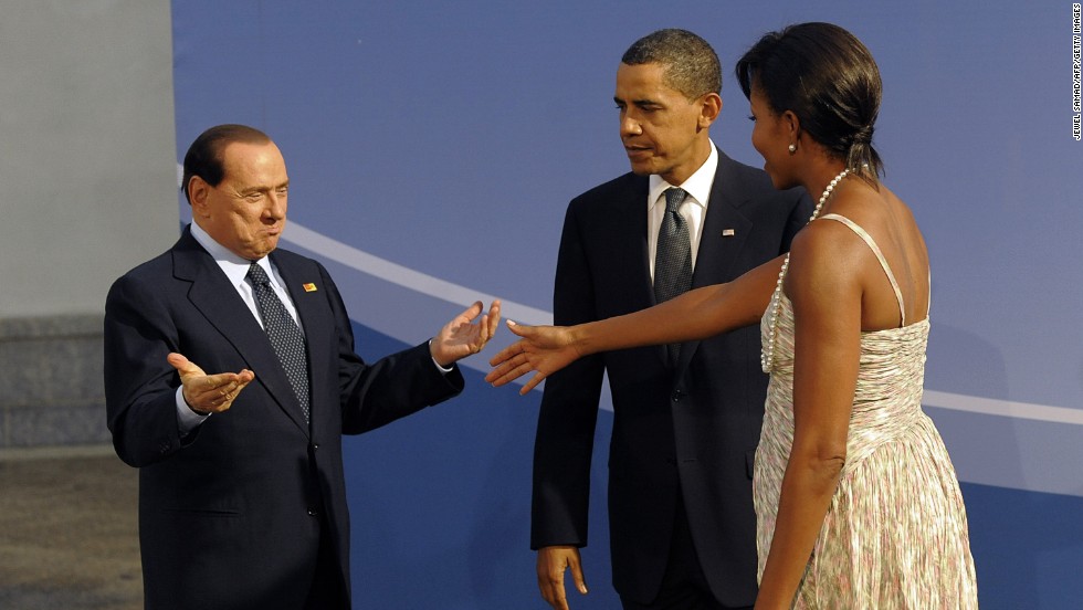 President Barack Obama and first lady Michelle Obama welcome Berlusconi to a G20 dinner in Pittsburgh in September 2009.