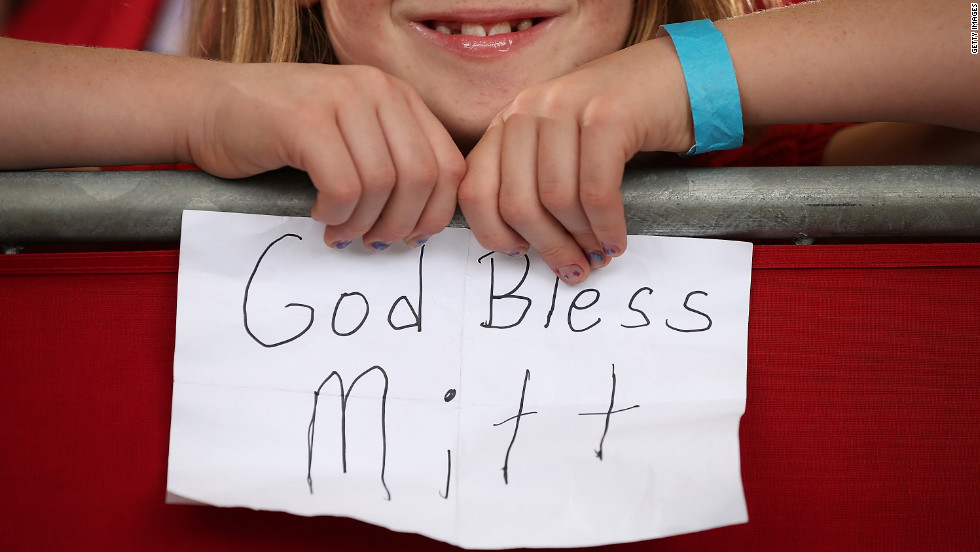 A young Romney supporter holds a homemade sign during a campaign rally at Ranger Jet Center on Saturday in Kissimmee, Florida.